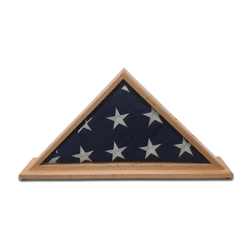 The Navy Veteran USN - Oak Burial Flag Display Case (5 x 9.5) by Legacies of America Woodworking Company features a neatly folded American flag with white stars on blue, honoring the service of any Navy Veteran.