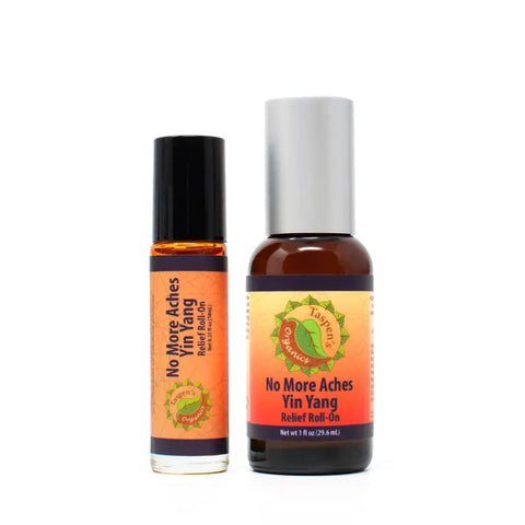Two bottles of Taspens Organics No More Aches Yin Yang Relief Roll-On are shown: a small one with a black cap and a larger one with a silver cap, both with orange labels featuring green accents for natural muscle relief.