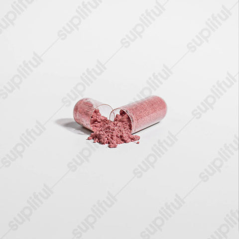A clear capsule of Norri Nutrition Beetroot has pink powder spilling onto a white surface, with a faint, diagonal “supliful” pattern in the plain background—alluding to cardiovascular wellness.