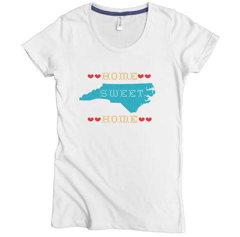 Show your love for the Tar Heel State with the NC Home Sweet Home Graphic Tee by Spiritex | Sustainable Apparel, made from soft organic cotton and featuring a blue NC outline, red hearts, and cross-stitch text.