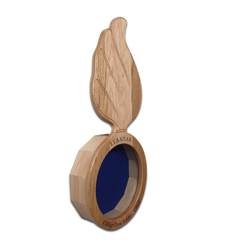 The Legacies of America Woodworking Companys Oak Ammo Pisspot Shadow Box is a flame-shaped wooden award with a blue circular center on a hexagonal Real Oak Hardwood base, featuring engraved text. Displayed on a plain white background.