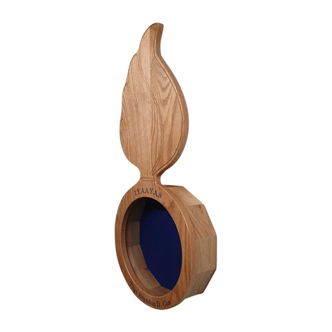 The Oak Ammo Pisspot Shadow Box by Legacies of America Woodworking Company is a real oak display case with a blue velvet-lined circular opening, flame-shaped top, and “IN.ALMA.S” and “Prof. Rolando D. Cruz” engraving. Made in the USA.