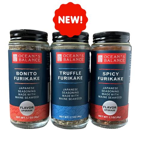 Ocean’s Balance Furikake Assortment features three 1.7 oz (48g) jars—Bonito, Truffle, and Spicy—displayed side by side with a red “NEW!” label above. Each jar contains premium seaweed rice seasoning.