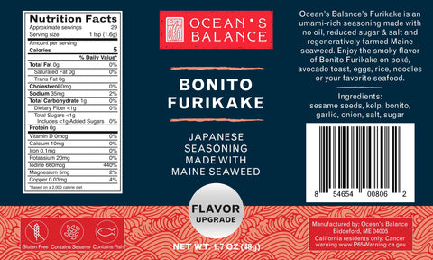 A blue and red package of Oceans Balance Furikake Assortment Japanese rice seasoning displays nutrition facts, ingredients, barcode, and a seaweed blend description with a sea wave pattern at the bottom.