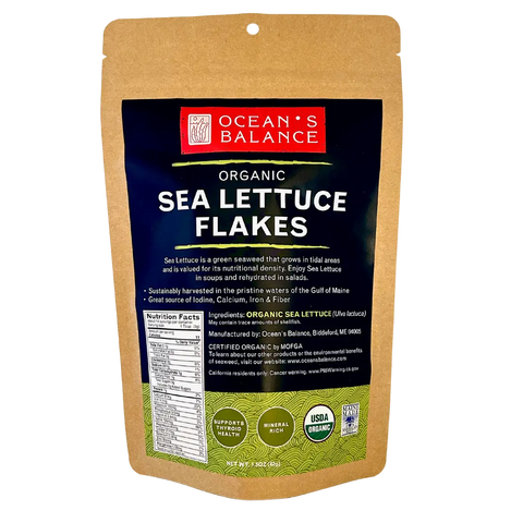 A brown pouch of Oceans Balance Organic Sea Lettuce Flakes displays product info, nutritional facts, and organic certification on the front—made from sustainably harvested seaweed.