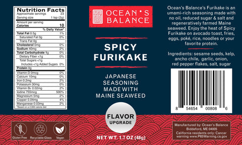Ocean’s Balance Spicy Furikake label includes nutrition facts, ingredients, barcode, and branding. Features regeneratively farmed Maine seaweed. Red wave pattern background with blue sections; white and red text.