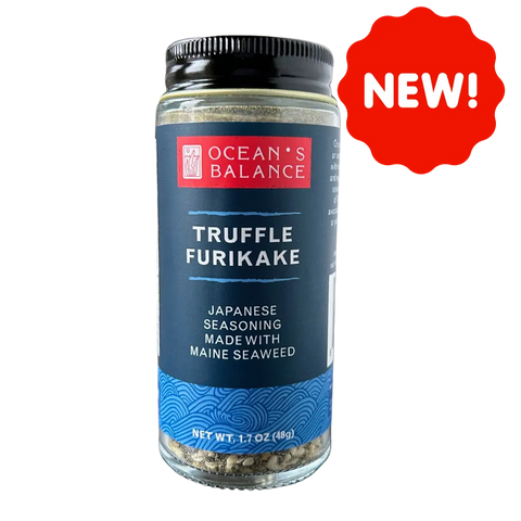 A jar of Oceans Balance Truffle Furikake, a vegan seaweed seasoning inspired by Japanese flavors and made with Maine seaweed. The blue label has a wave pattern, and a red NEW! starburst appears in the top right corner.