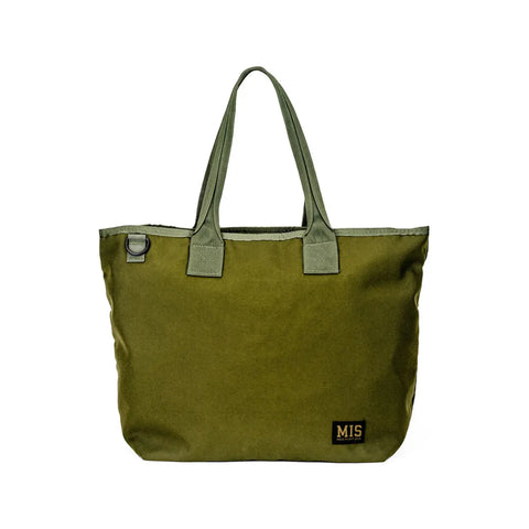 The MIS Tote Bag - Olive Drab is water-resistant, features two handles, a small MIS tag at the lower right corner, and a black plastic loop near the top left edge.