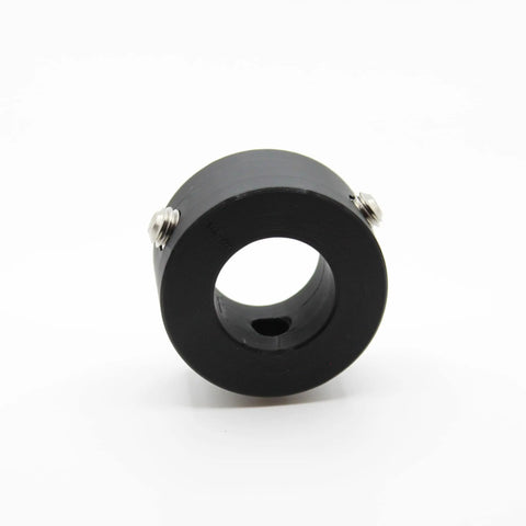 The Weight It Out Olympic Plate to Standard Bar Adapter (2 to 1) is a black cylindrical plastic component with a central hole and two metal screws, designed for durability, shown on a white background.