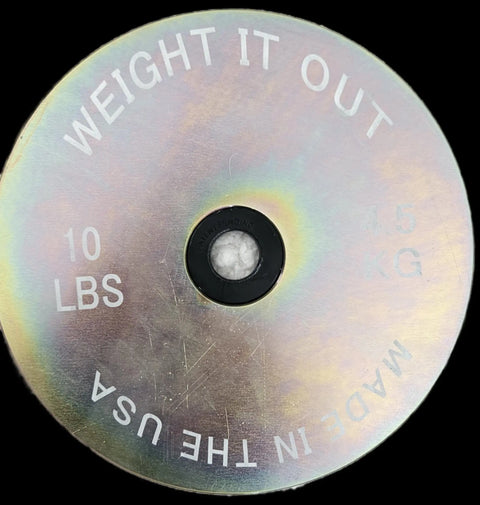 The Weight It Out Olympic Plate to Standard Bar Adapter (2 to 1) features durable construction, a sleek finish, and allows you to use Olympic plates on standard 1-inch barbells—perfect for upgrading your home gym setup.
