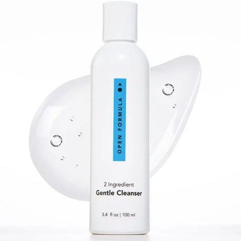 A white bottle of Open Formula Gentle Cleanser (3.4 fl oz/100 mL) stands upright, with clear gel and air bubbles behind it, showcasing its minimalist design made for sensitive skin and gentle deep pore cleansing.