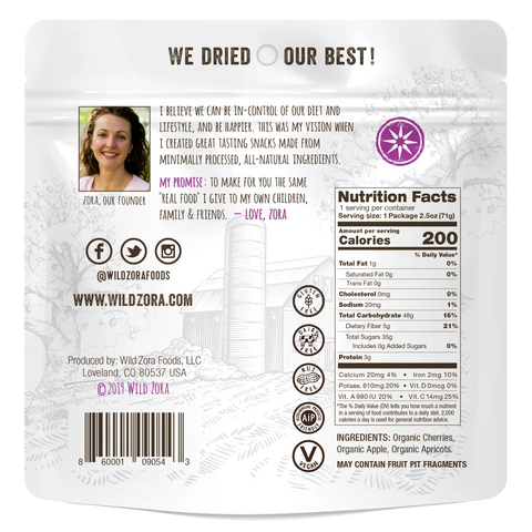 Back of Wild Zora Fruits - Orchard Air-Dried Mix With Cherries, Apples & Apricots 2-Pack shows a founders message, nutrition facts, ingredients like organic cherries/apples, social media info, and a womans image in the top left.