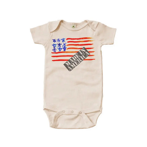 The Made in America Graphic Bodysuit by Spiritex | Sustainable Apparel features a cream-colored organic cotton fabric with a stylized American flag and MERICA AMERICA print—gentle for sensitive skin and proudly made in the USA.