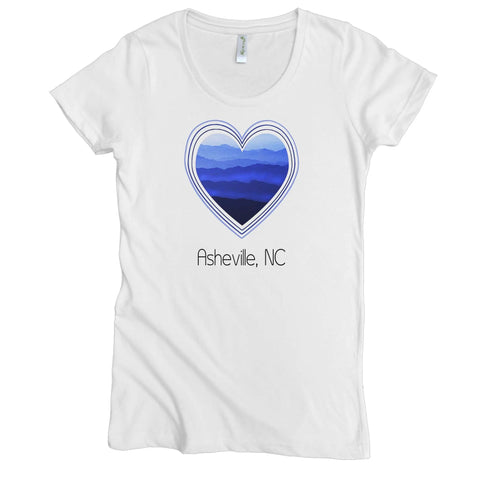 The Spiritex | Sustainable Apparel Blue Ridge Heart Graphic Tee is a women’s top made from 100% organic cotton, featuring a mountain layers heart design and “Asheville, NC” below.