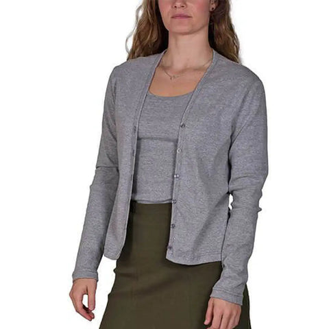 A woman in a light gray Spiritex | Sustainable Apparel Classic Tank and an olive green 100% organic cotton skirt stands against a plain white background.