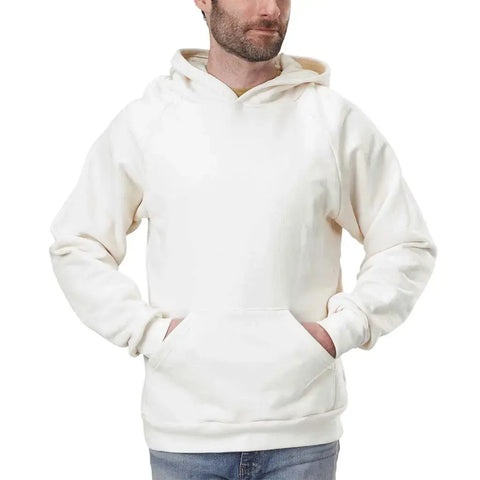 A man wearing a Spiritex | Sustainable Apparel Heavyweight Fleece Hoodie in plain off-white, featuring a lined hood and front pocket, stands against a white background.