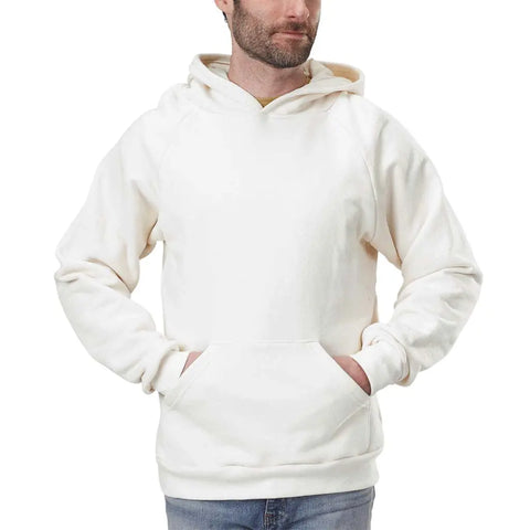 A man wearing a Spiritex | Sustainable Apparel Heavyweight Fleece Hoodie in plain off-white, featuring a lined hood and front pocket, stands against a white background.