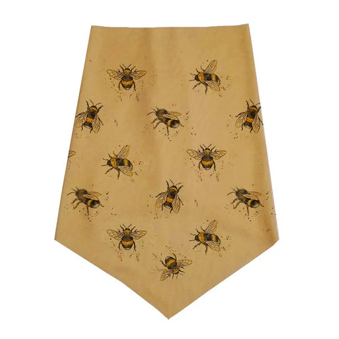 The Infinity Bandana by Spiritex | Sustainable Apparel is an eco-friendly, light brown organic cotton bandana with a pointed end, featuring a repeating black and yellow bee illustration pattern.
