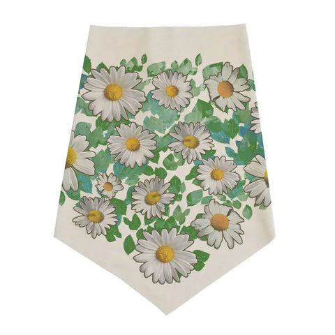 The Infinity Bandana by Spiritex | Sustainable Apparel is an organic cotton accessory with a pointed end, adorned with bold white daisies, yellow centers, and green leaves on a light background—perfect as a bandana or table runner.