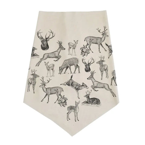 The Infinity Bandana by Spiritex | Sustainable Apparel is a cream organic cotton bandana featuring intricate black deer illustrations in varied poses, including standing, lying down, and grazing, printed across its surface.