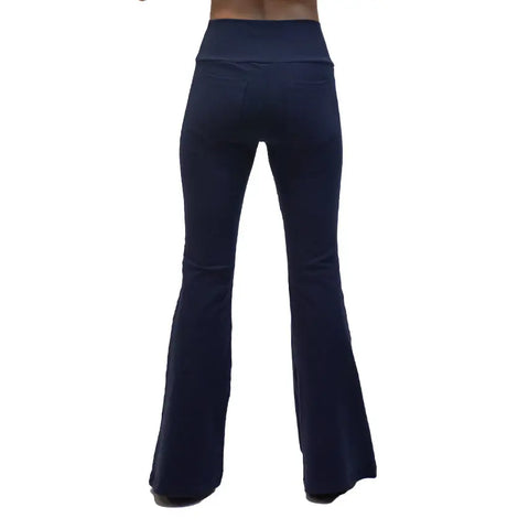 A person models Spiritex | Sustainable Apparel’s dark blue high-waisted Lycra Bell Bottoms, shown from the back against a white background.