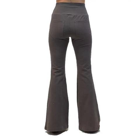 A person is shown from the back wearing Spiritex | Sustainable Apparel Lycra Bell Bottoms, high-waisted and dark gray with visible back pockets, made from organic cotton, standing against a plain white background.