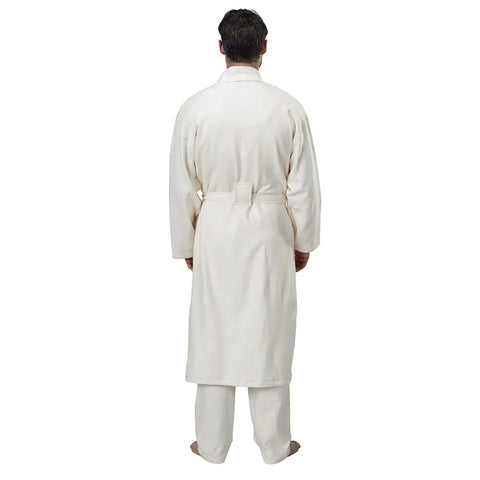 A man faces away from the camera in the Spiritex | Sustainable Apparel Mid-Length Fleece Robe, paired with white pants. The unisex robe’s clean design stands out against a plain background, highlighting its comfort and style.