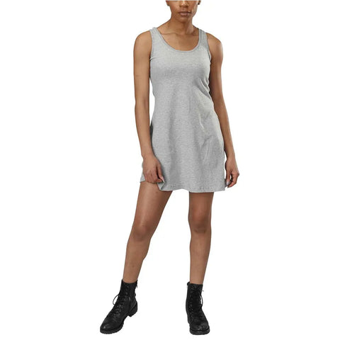 A person wearing the Spiritex | Sustainable Apparel Racerback Tank Dress and black lace-up boots stands against a white background.