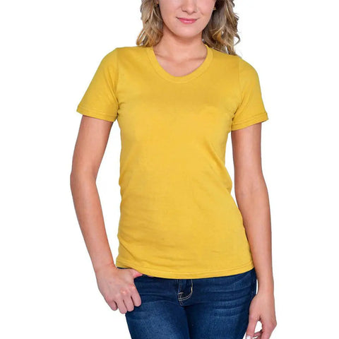 A woman wearing the Spiritex | Sustainable Apparel Short Sleeve Favorite Crewneck Tee (W) in yellow and blue jeans stands with one hand in her pocket against a white background.