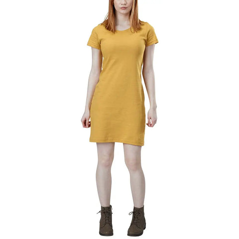A woman wearing the Spiritex | Sustainable Apparel Short Sleeve Crewneck T-Shirt Dress and brown lace-up ankle boots stands facing forward against a white background.