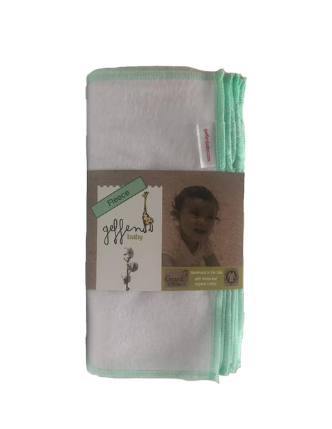 A folded white Geffenbaby fleece baby blanket with mint green edges, wrapped in packaging featuring a giraffe and baby photo, highlights organic cotton, USA-made quality, and pairs perfectly with Geffenbaby Reusable Baby Wipes - Fleece.