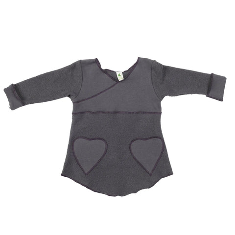 The Spiritex Heavy Terry Heart Pocket Tunic Sweatshirt is a long-sleeved, dark gray toddler top featuring a wrap-style neckline, two heart pockets, and soft, textured fabric for comfort and charm.