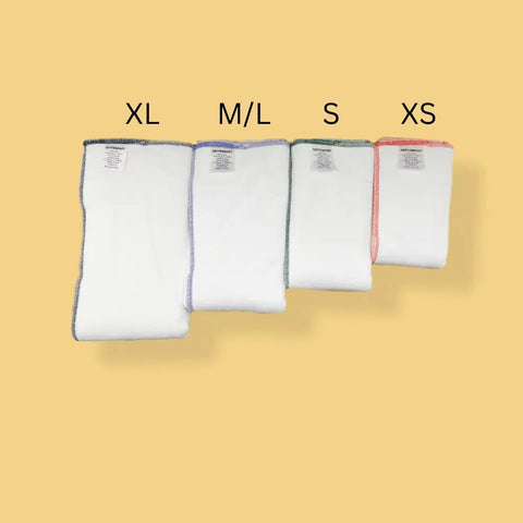 Four Geffenbaby Cloth Prefold Diapers—super absorbent fleece hemp and organic cotton inserts in sizes XL, M/L, S, XS—are arranged by size on yellow. Each has a colored border and a label above showing its size.