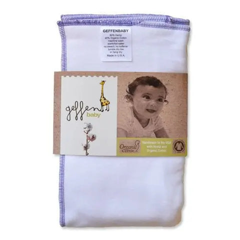 A folded white Geffenbaby Cloth Prefold Diaper with purple trim is shown. The packaging displays a smiling baby and giraffe, highlighting its handmade in the USA from organic cotton and super-absorbent fleece hemp—great as a reusable diaper insert.
