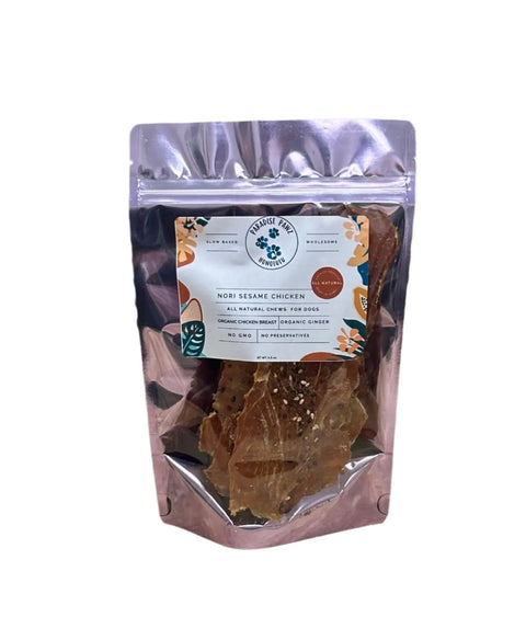 Dogtown Bakery’s Nori Sesame Chicken organic dog treats come in a clear, floral resealable pouch that shows the product inside. The label highlights Hawaiian-inspired flavor, all-natural ingredients, and no preservatives.
