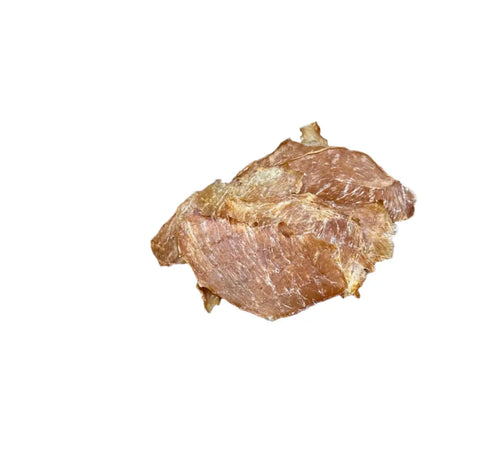 A piece of Dogtown Bakerys Pineapple Chicken Jerky is centered on a plain white background, crafted with organic chicken and ideal for pups with digestive sensitivities.