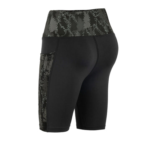 Fireside Pine’s Pacific Yew - Gunmetal biker shorts feature a high-rise waist, forest tree pattern on the waistband and side panels, double pockets, and are shown from the back in black and dark green.