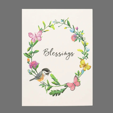The JuLu Cards Pack of 4 – “Blessings” features cards with cursive text, a floral wreath, butterflies, and a bird. Perfect for gifting and comes with matching envelopes. Design: Blessings With Bird and Butterflies on Wreath (20038).