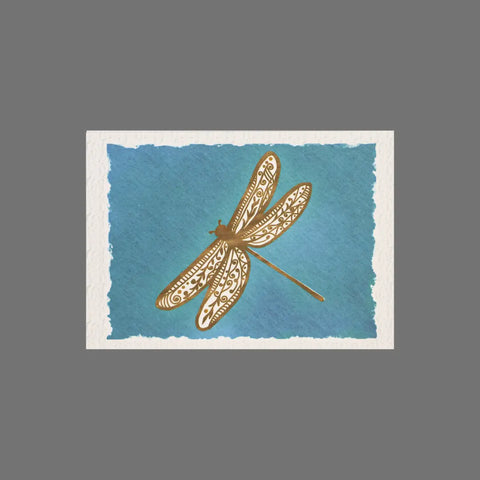 A JuLu Cards Pack of 8 - Brown Dragonfly With Blue Background (10003) features a detailed dragonfly on blue, postcard-sized fronts with white edges—ideal for pairing with envelopes.