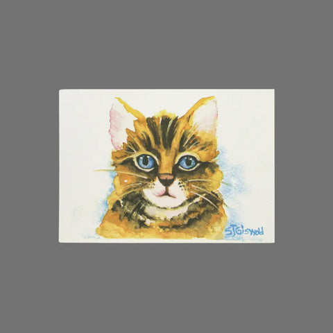JuLu Cards Pack of 8 – Cat With Blue Eyes and Blue Hazy Background (10029) features a watercolor tabby cat with blue eyes, centered on a soft blue haze. Ideal for 3.5 x 5 cards with envelopes, each bears the artist’s signature.