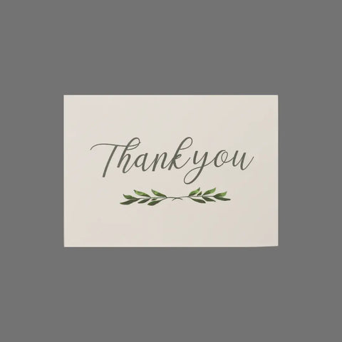 The JuLu Cards Pack of 8 - Thank You With Branch and Leaves (10001) features elegant cursive with a green leafy branch on white 3.5 x 5 cards, set against a gray background. Includes envelopes, perfect for any occasion.