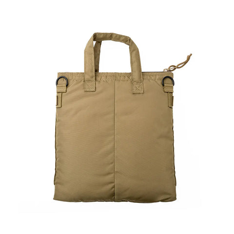 The MIS Padded F Helmet Bag S in Coyote Tan features a rectangular packcloth nylon design, two short handles, padded main compartment, black D-rings on each top corner, and a right-side zipper pull, shown on a white background.