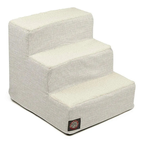The Palette Heathered 3 Steps Pet Stairs (Heavy Duty) by Majestic Pet features a light beige, fabric cover, non-slip steps, and a small logo patch on the front corner to help pets safely reach higher surfaces.