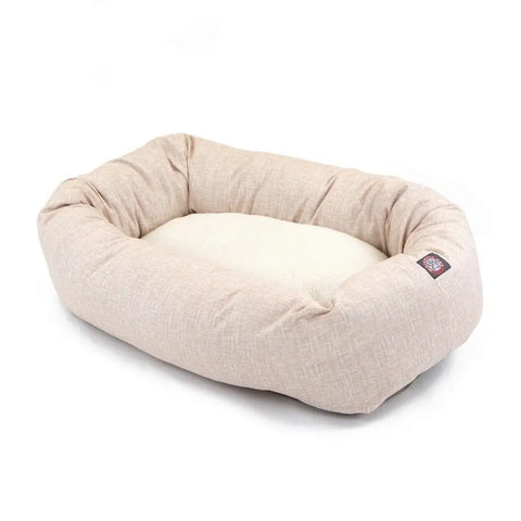 The Palette Heathered Sherpa Bagel Dog Bed by Majestic Pet features raised cushioned sides for spine support and a cream-colored sleeping area. Its machine-washable cover ensures easy care. Pictured on a white background.