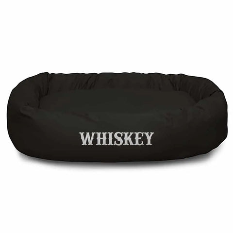 The Majestic Pet Poly/Cotton Bagel Bed - Personalized in black features WHISKEY embroidered in white capitals, offers excellent spine support, and has a machine-washable design for easy care.