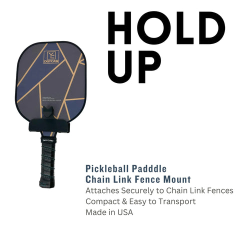 The Chatelet Manufacturing Pickleball Paddle Chain Link Fence Holder, in black and gold, securely mounts your paddle to the court fence. Compact, portable, and made in the USA—an essential accessory with bold HOLD UP text for every pickleball player.