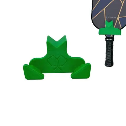 The Chatelet Manufacturing Pickleball Paddle Chain Link Fence Holder securely mounts your paddle with its black and gold geometric face on the court, keeping it easily accessible between games. Compact, portable, and made in the USA.