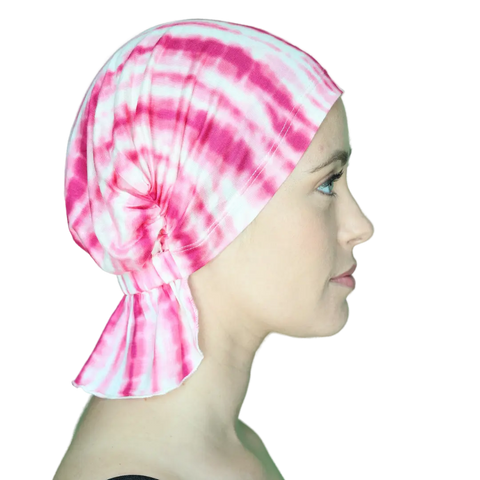 A woman in profile wears the Chemo Beanies® Scarves - Chemo Beanies® - Tanisha, looking to the right against a plain black background that highlights her face and this stylish hair loss headwear.