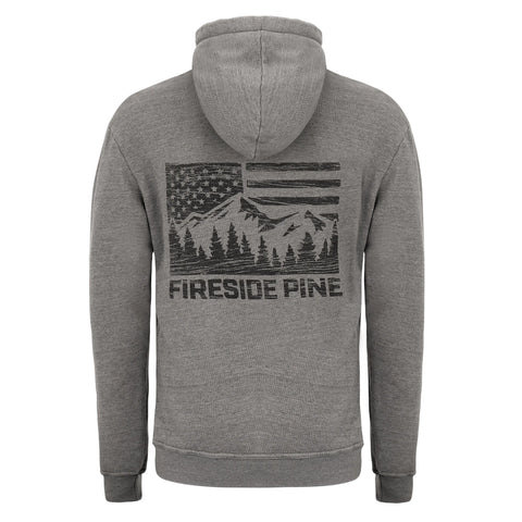 The Fireside Pine “Ponderosa Pine - Gunmetal” is a gray French Terry Fleece sweatshirt with a black back graphic of an American flag, mountains, pines, and “FIRESIDE PINE”—a cozy pullover for cool evenings.