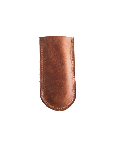 The Homestead Brand Skillet Handle Sleeve No. 2002 is a brown leather handle cover with visible stitching, displayed on a white background.